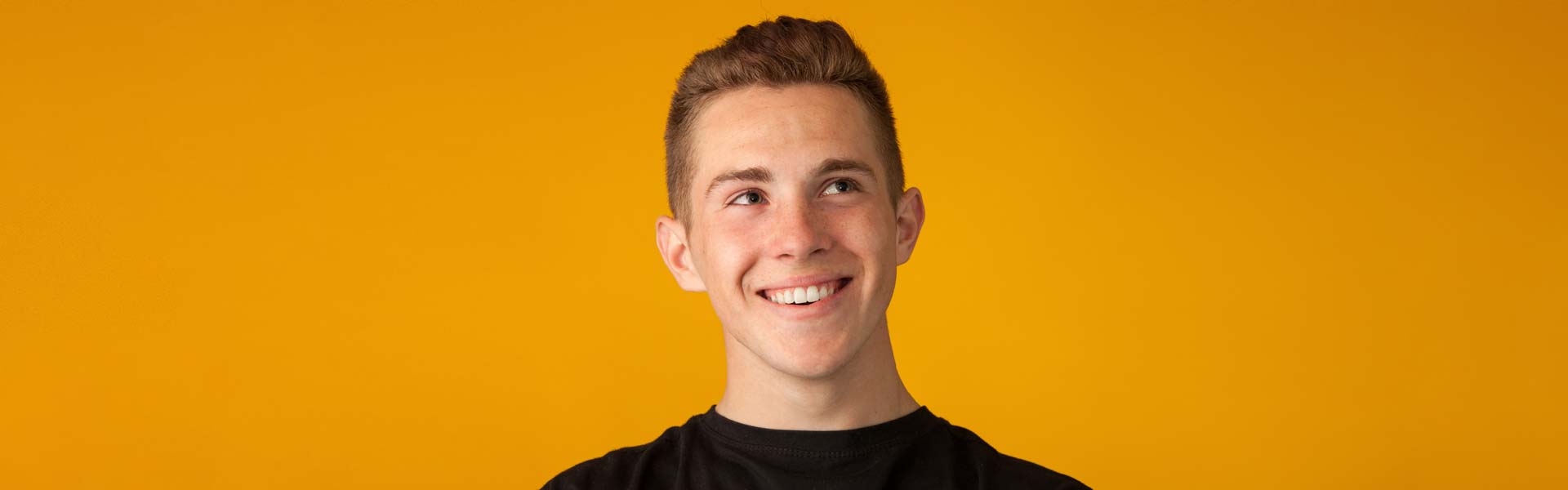 An employee who uses salary sacrifice to customise his employee benefits smiles for the camera